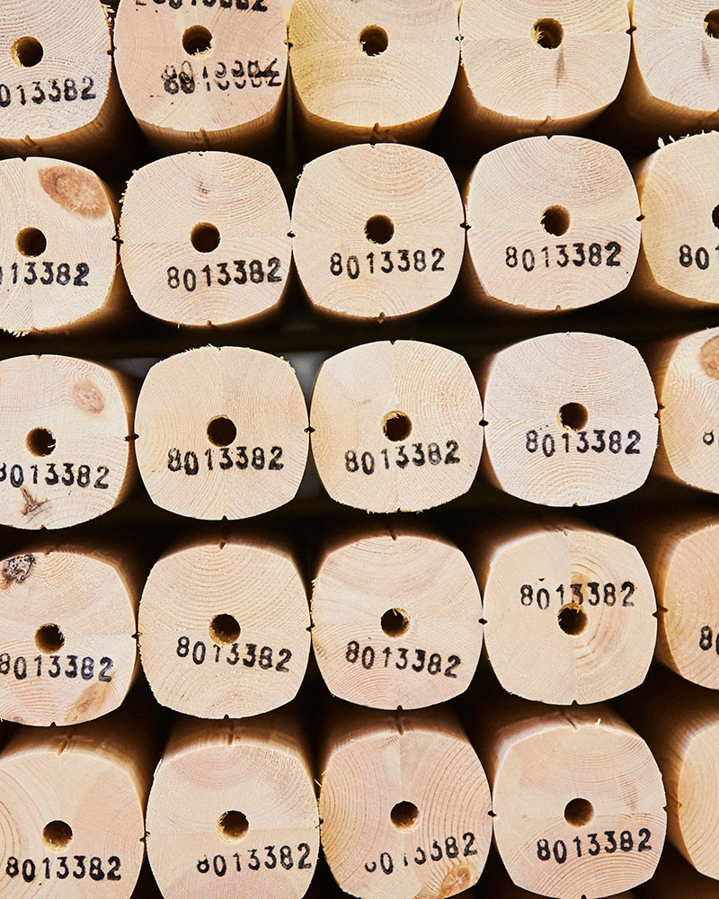 Close up of wooden poles which are used for playgrounds at the warehouse.